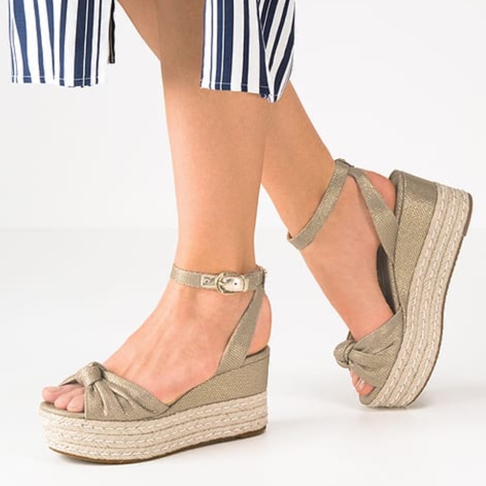 Michael Kors maxwell metallic gold wedge sandal.